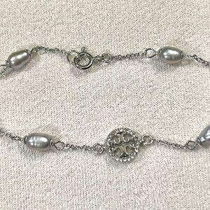 Tory Burch silver-tone charm bracelet with grey pearls